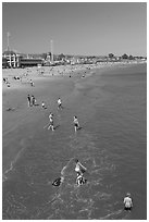 Children playing on the beach. Santa Cruz, California, USA (black and white)