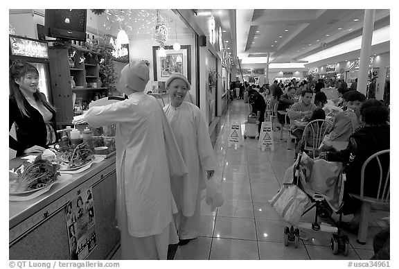 Buddhist nuns in the foot court of the Grand Century mall. San Jose, California, USA (black and white)