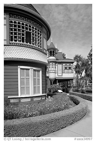 Mansion wing with door to nowhere in the background. Winchester Mystery House, San Jose, California, USA (black and white)