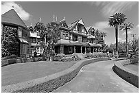 Gardens and facade. Winchester Mystery House, San Jose, California, USA (black and white)