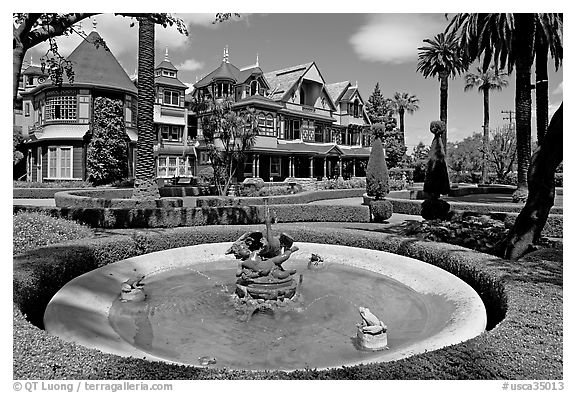 Basin, gardens and facade. Winchester Mystery House, San Jose, California, USA (black and white)