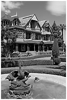 Fountain and facade. Winchester Mystery House, San Jose, California, USA (black and white)