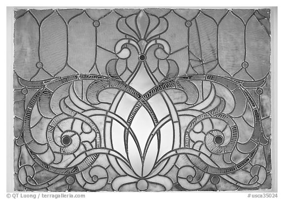 Decorated glass window. Winchester Mystery House, San Jose, California, USA (black and white)
