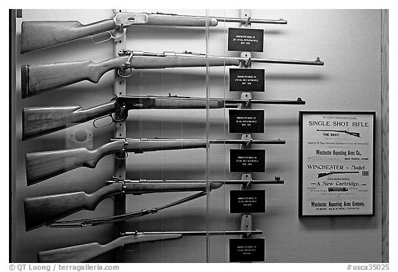 Collection of Winchester rifles. Winchester Mystery House, San Jose, California, USA (black and white)