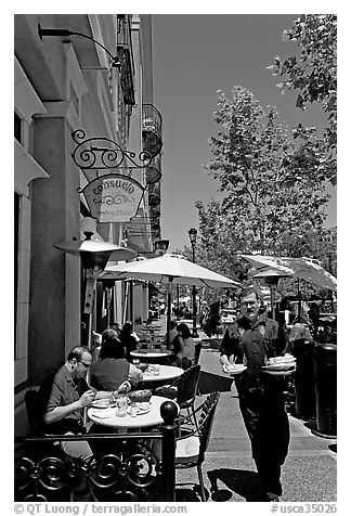 Streetside restaurant terrace and waiter. Santana Row, San Jose, California, USA