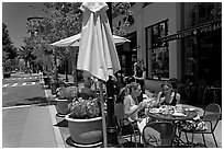 Street and outdoor restaurant tables. Santana Row, San Jose, California, USA (black and white)