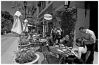 Lunch at streetside restaurant tables. Santana Row, San Jose, California, USA ( black and white)