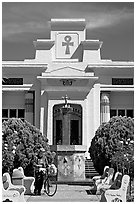 Person walking a bike, Rosicrucian Park. San Jose, California, USA (black and white)