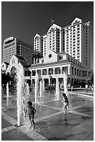 Children, fountain, Plaza de Cesar Chavez  and Fairmont Hotel. San Jose, California, USA (black and white)