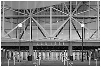 Facade of HP pavilion with San Jose sign reflecting sunset colors. San Jose, California, USA (black and white)