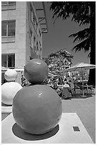 Sculpture  and outdoor restaurant terrace, Castro Street, Mountain View. California, USA (black and white)