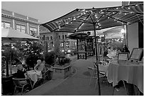 Restaurant dining on outdoor tables, Castro Street, Mountain View. California, USA ( black and white)