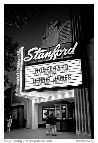 Couple standing in front of Stanford Theatre at night. Palo Alto,  California, USA