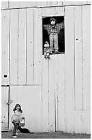 Girl and figures in barn window, Happy Hollow Farm, Rancho San Antonio Park, Los Altos. California, USA (black and white)