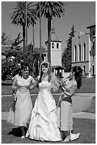 Bride and bridesmaids in front of mission, Santa Clara University. Santa Clara,  California, USA (black and white)