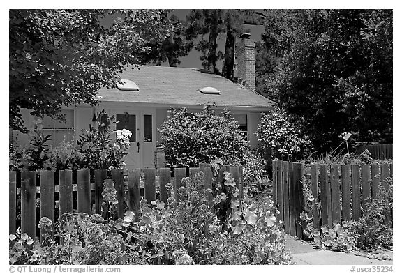 House with flowers in front yard. Menlo Park,  California, USA (black and white)