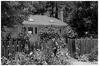 House with flowers in front yard. Menlo Park,  California, USA (black and white)