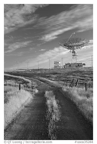 Gravel road leading to parabolic antenna, late afternoon. Stanford University, California, USA