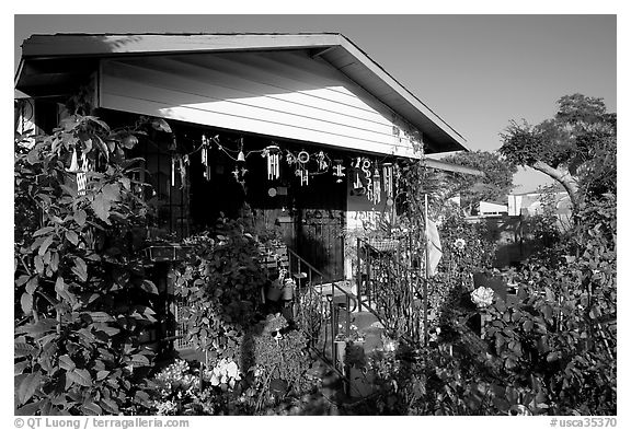 House and frontyard, Watts. Watts, Los Angeles, California, USA (black and white)