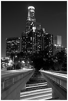 Bridge above Harbor Freeway and US Bank building at night. Los Angeles, California, USA (black and white)