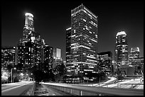 Bridge, traffic lights and Los Angeles skyline at night. Los Angeles, California, USA (black and white)