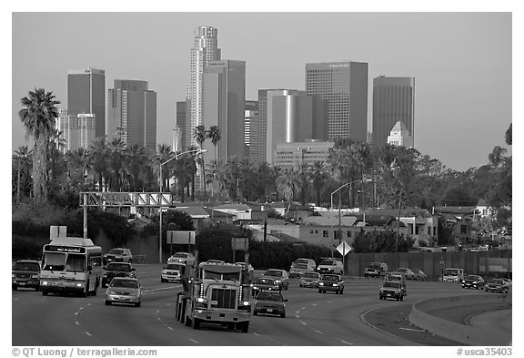 Traffic on freeway and skyline, early morning. Los Angeles, California, USA (black and white)