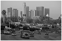 Traffic on freeway and skyline, early morning. Los Angeles, California, USA (black and white)