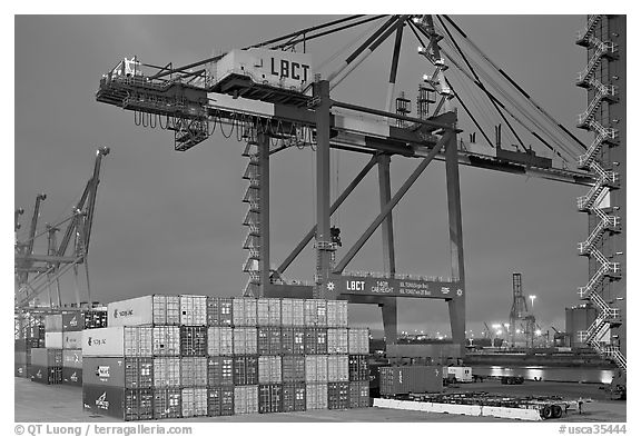 Countainers and cranes, Port of Los Angeles, dusk. Long Beach, Los Angeles, California, USA