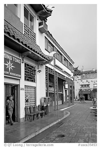 Man at doorway and plaza, Chinatown. Los Angeles, California, USA (black and white)