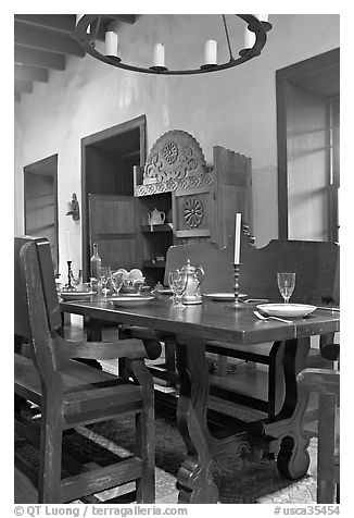 Room furnished in heavy oak in the Avila Adobe. Los Angeles, California, USA (black and white)
