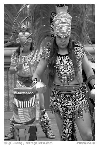 Aztec dancers performing, El Pueblo historic district. Los Angeles, California, USA (black and white)