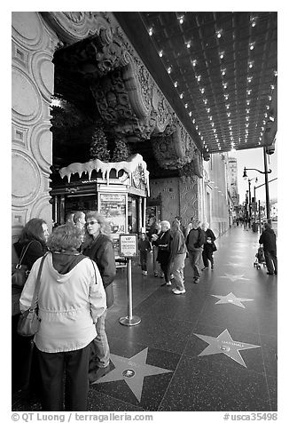 Stars of the Walk of fame in front of the  El Capitan Theatre. Hollywood, Los Angeles, California, USA (black and white)