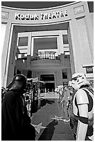 People dressed as Star Wars characters in front of the Kodak Theater, home of the Academy Awards. Hollywood, Los Angeles, California, USA (black and white)
