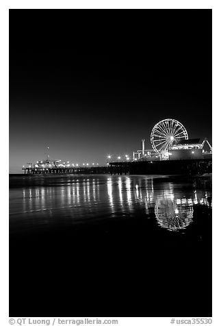 Ferris Wheel and pier at night. Santa Monica, Los Angeles, California, USA (black and white)