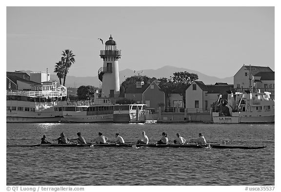 Women Rowers and lighthouse, early morning. Marina Del Rey, Los Angeles, California, USA (black and white)