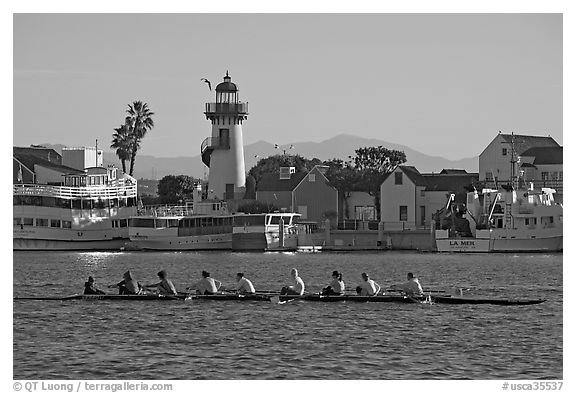 Women Rowers and lighthouse, early morning. Marina Del Rey, Los Angeles, California, USA