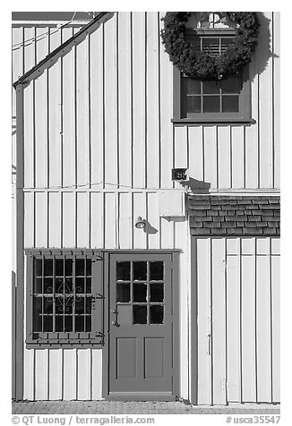 Wooden house with bright blue door. Marina Del Rey, Los Angeles, California, USA (black and white)