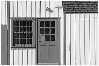 Facade of house with blue doors and windows. Marina Del Rey, Los Angeles, California, USA (black and white)