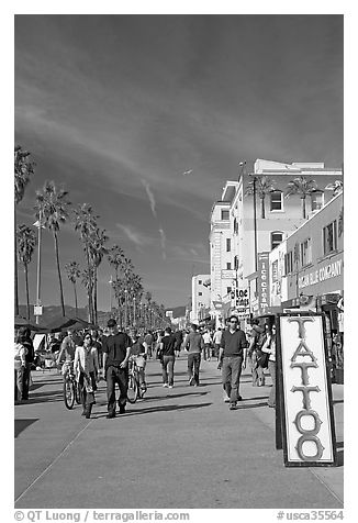 Tatoo sign and colorful Ocean Front Walk. Venice, Los Angeles, California, USA (black and white)