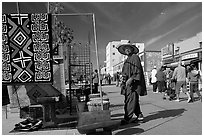 Man selling crafts on Venice Boardwalk. Venice, Los Angeles, California, USA (black and white)