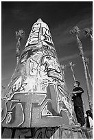 Man creating  graffiti art. Venice, Los Angeles, California, USA (black and white)