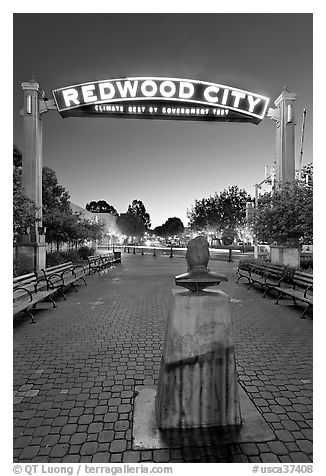 Plaza with Climate Best by Government Test sign at night. Redwood City,  California, USA (black and white)