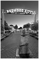 Plaza with Climate Best by Government Test sign at night. Redwood City,  California, USA ( black and white)