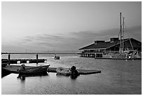 Marina, with small boat comming back to port at sunset. Redwood City,  California, USA ( black and white)