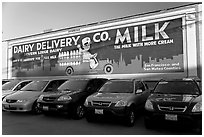 Historic advertising mural, in a car dealership lot. Burlingame,  California, USA (black and white)