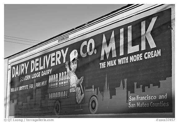 Vintage advertising mural, one of the first of its kind. Burlingame,  California, USA (black and white)