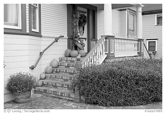 House entrance with pumpkins. Half Moon Bay, California, USA (black and white)