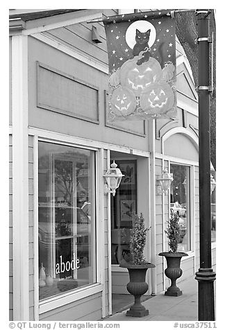 Storefront on Main Street with Halloween street decor. Half Moon Bay, California, USA (black and white)