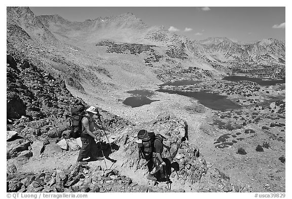 Backpackers descending from Bishop Pass, John Muir Wilderness. California, USA (black and white)