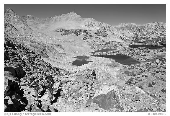 Backpackers hiking up from Saddlebag Lakes, John Muir Wilderness. California, USA